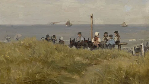 Kinderen op ezeltjes in de duinen met op de achtergrond de zee